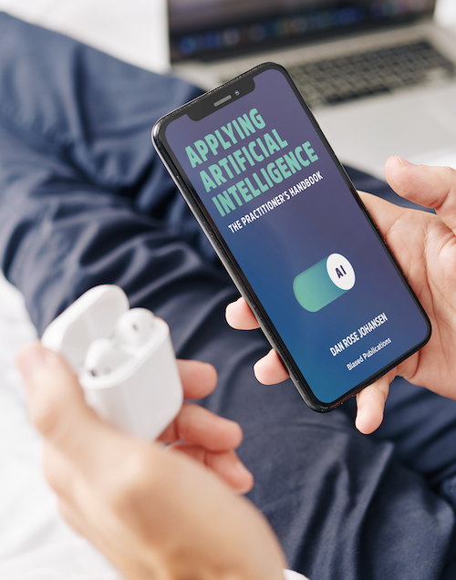Cover of Applying Artificial Intelligence on a smart phone being held in a male hand